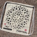 paris manhole cover on bags