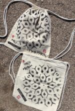 paris manhole cover on bags