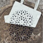 paris manhole cover on bags