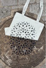 paris manhole cover on bags