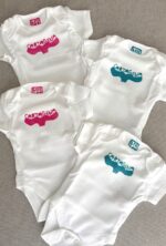 cartagena baby onesie — whale tail linoprint