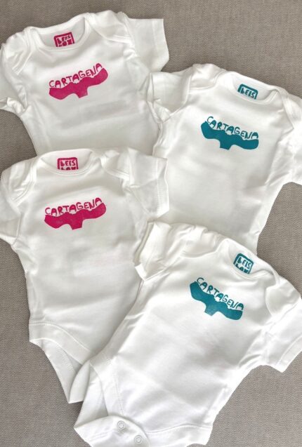 cartagena baby onesie — whale tail linoprint