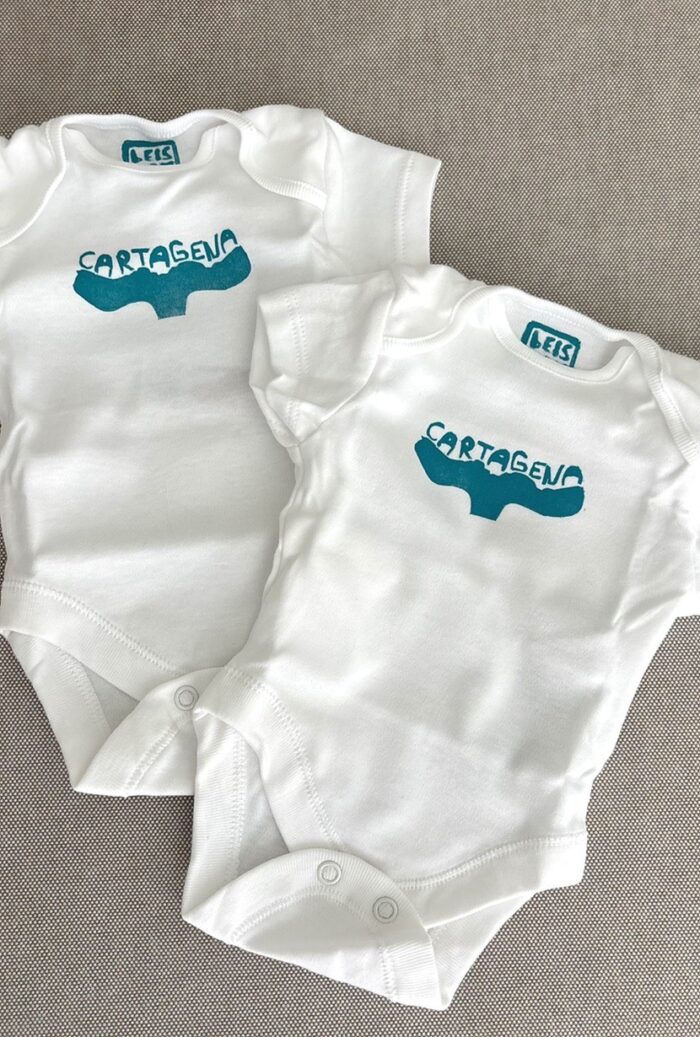 cartagena baby onesie — whale tail linoprint