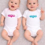 cartagena baby onesie — whale tail linoprint