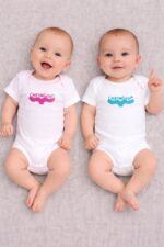 cartagena baby onesie — whale tail linoprint