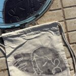 Cartagena The Hidden Face Manhole Print Drawstring Backpack